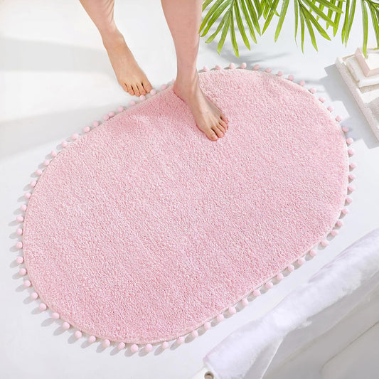 YIRDDEO Bath Mat Pink Rug with Pom Oval Bathroom Rugs for Bedroom Non Slip Cute Boho Absorbent Mats Soft Plush Washable Rug (24x36 inches)