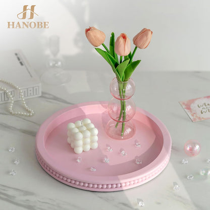 Pink Round Decorative Tray with Beaded Edge | Durable paulownia wood, for displaying perfumes, candles, or jewelry on a dresser, coffee table, vanity, bathroom counter.
