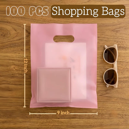 100 Pcs Plastic Bags With Handles 9"x12", Clear Gift Bags Shopping Merchandise bags for Small Business Retail Stores Gifts (Pink)