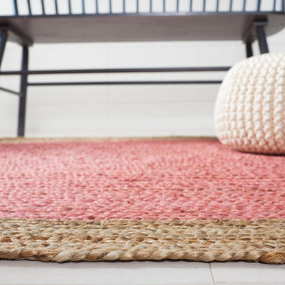 SAFAVIEH Area Rug 6x9 Oval - Natural Fiber Collection - Pink & Natural Brown, Handmade Jute, Braided Border Design (NF801P)