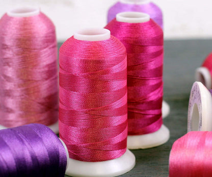 Polyester Machine Embroidery Thread, 1000M 40wt, Blush Pink 166 | 40wt trilobal polyester embroidery thread with bright sheen. Works with home and commercial embroidery and sewing machines.