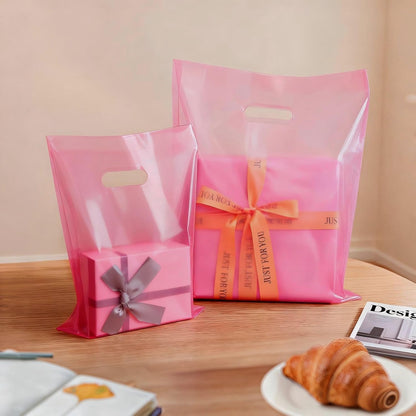 100 Pcs Plastic Bags With Handles 9"x12", Clear Gift Bags Shopping Merchandise bags for Small Business Retail Stores Gifts (Pink)
